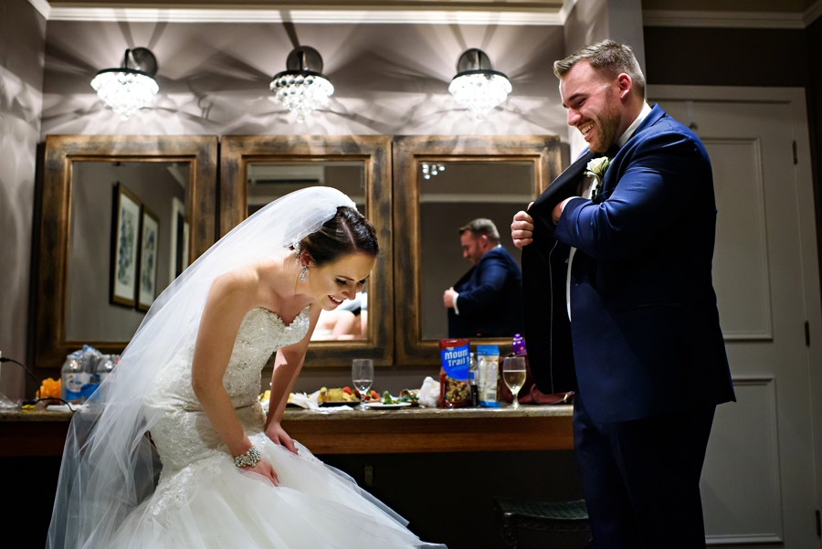 A newly married couple laughing.